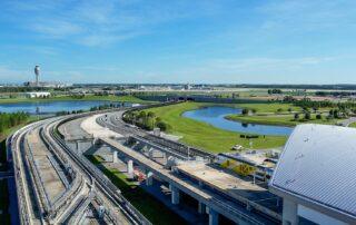 Two trains looking north at OIA | Luxury Orlando Homes for Sale | Daniel Wilson REMAX Orlando Real Estate Expert