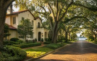 Moving to Winter Park FL guide featuring a historic-style home on a brick street near a lake