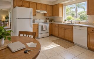 Selling As is in Orlando — Home Preparation Guide | Luxury Orlando Homes for Sale | Daniel Wilson Remax Orlando Real Estate Expert Oak-cabinet kitchen with keys and paint samples, illustrating selling as is in Orlando